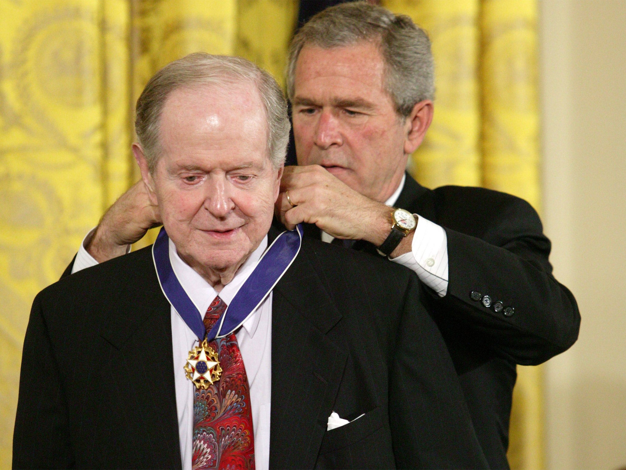 Conquest receives the Presidential Medal of Freedom from George W Bush in 2005