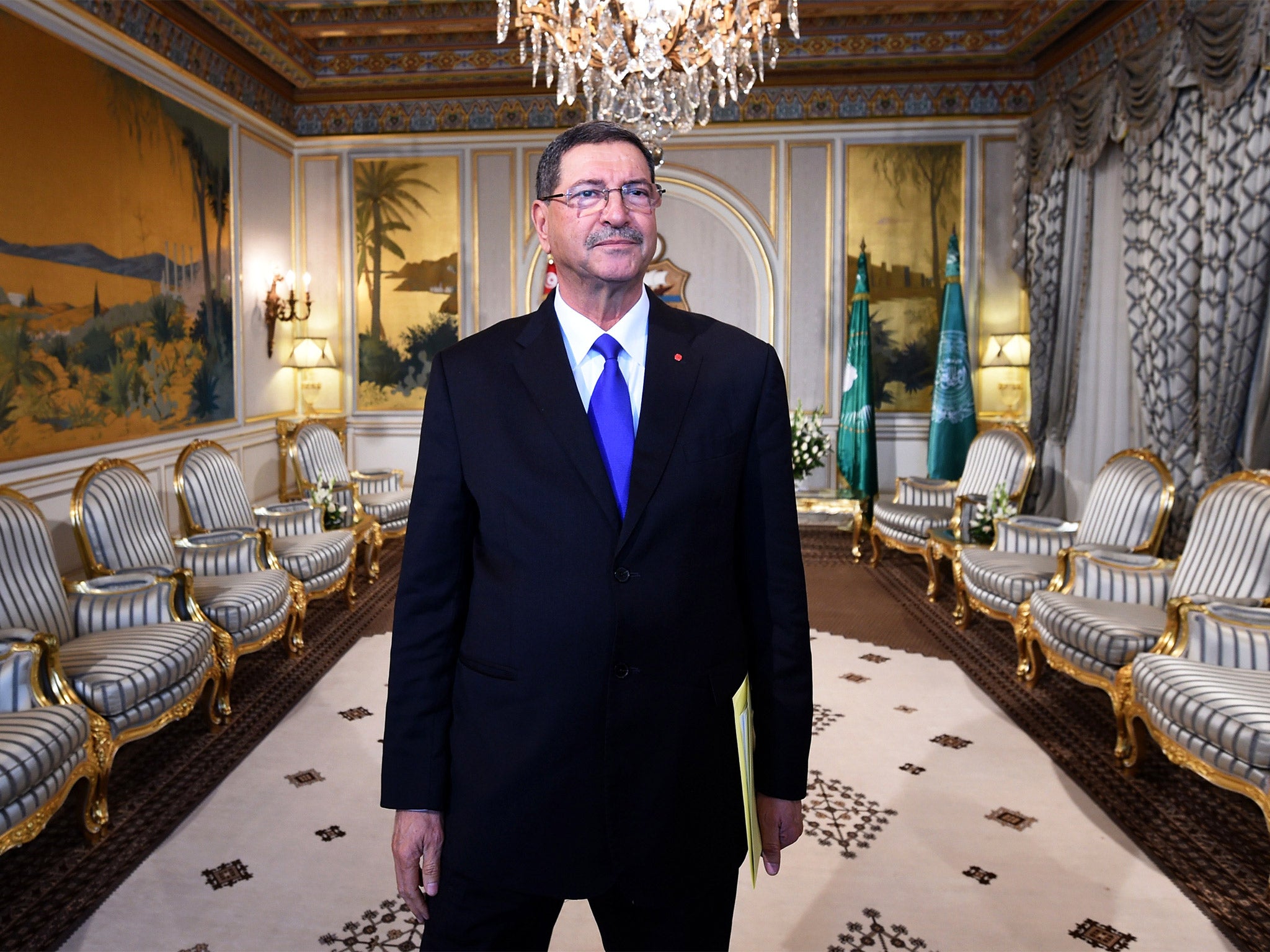 Tunisian Prime Minister Habib Essid says the authorities are working closely with Britain to trace terror networks