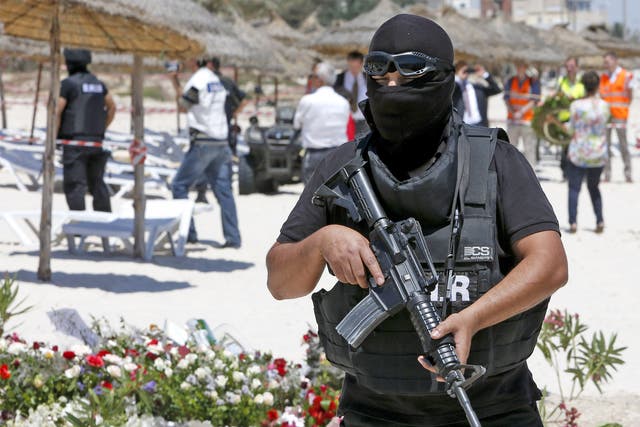 <p>A Tunisian police officer at the scene of the June 2015 attack in Sousse</p>