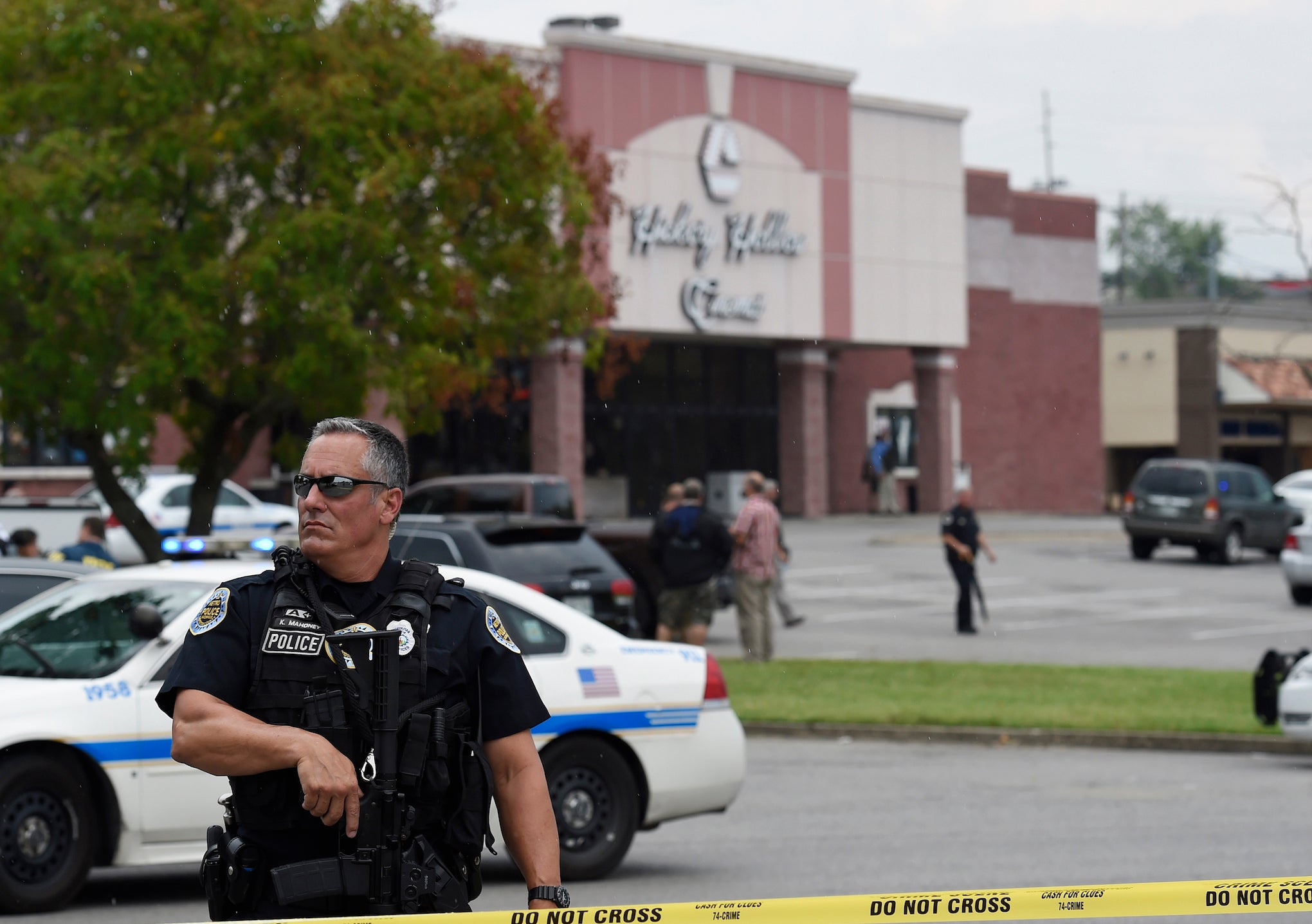 An officer stands in front of the Carmike Hickory 8 movie theatre following a shooting on 5 August 2015, in Antioch, Tennessee.