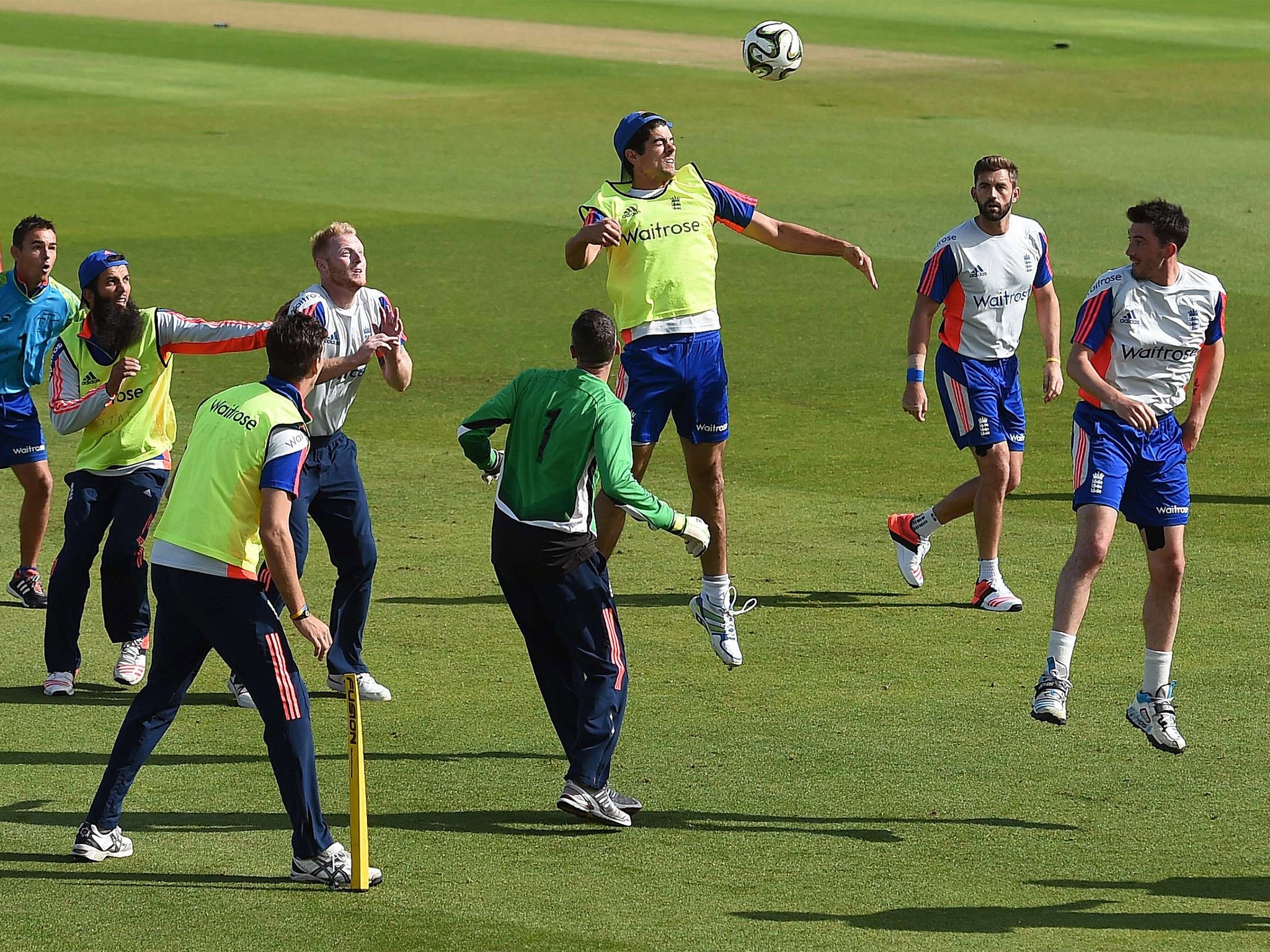 England captain Alastair Cook rises highest to head a football in training at Trent Bridge