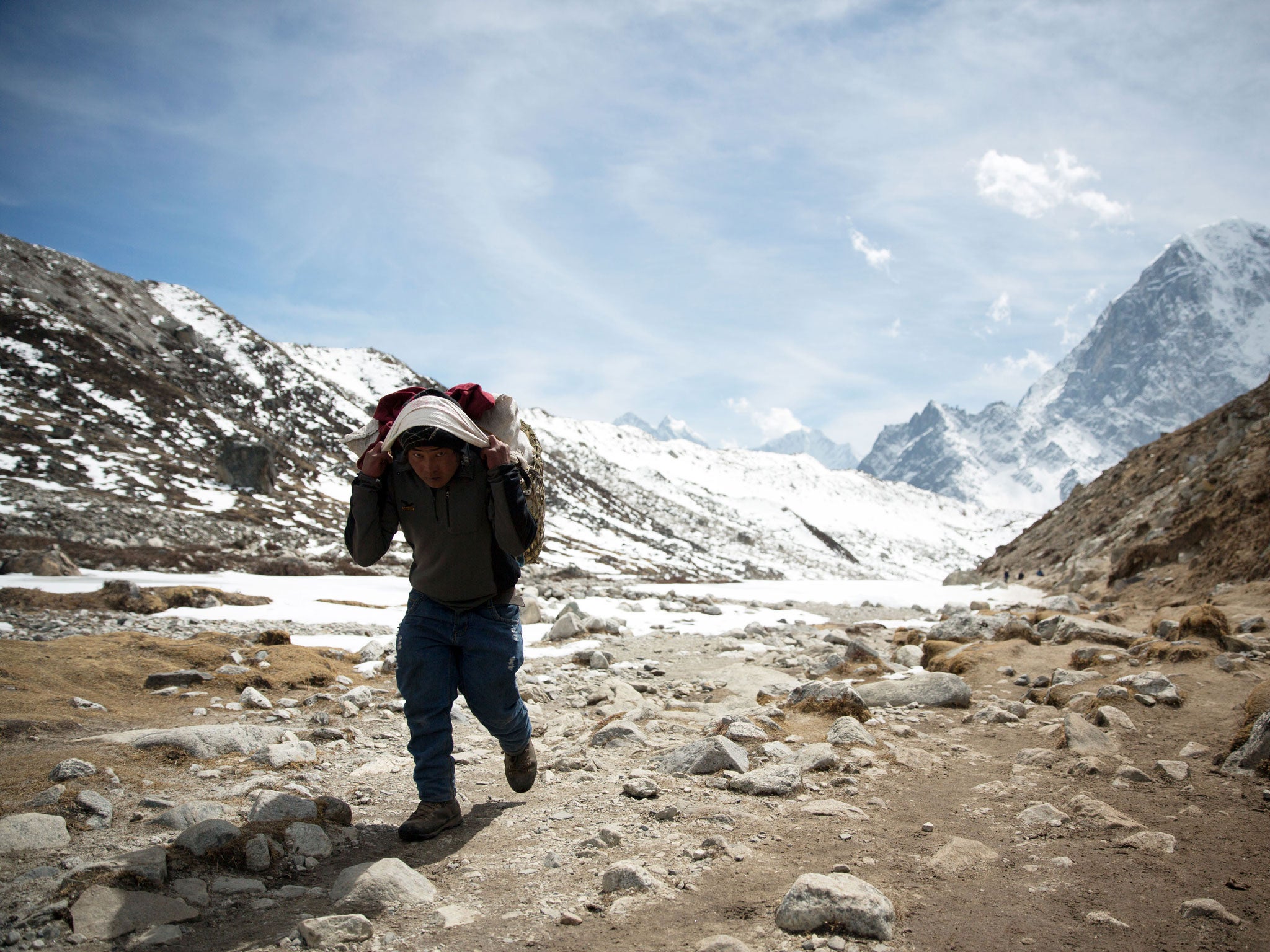 A sherpa carrying kit to Everest Base Camp