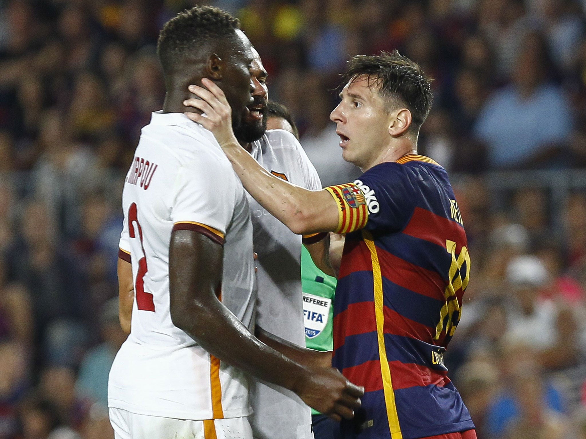 Lionel Messi grabs the throat of Mapou Yanga-Mbiwa