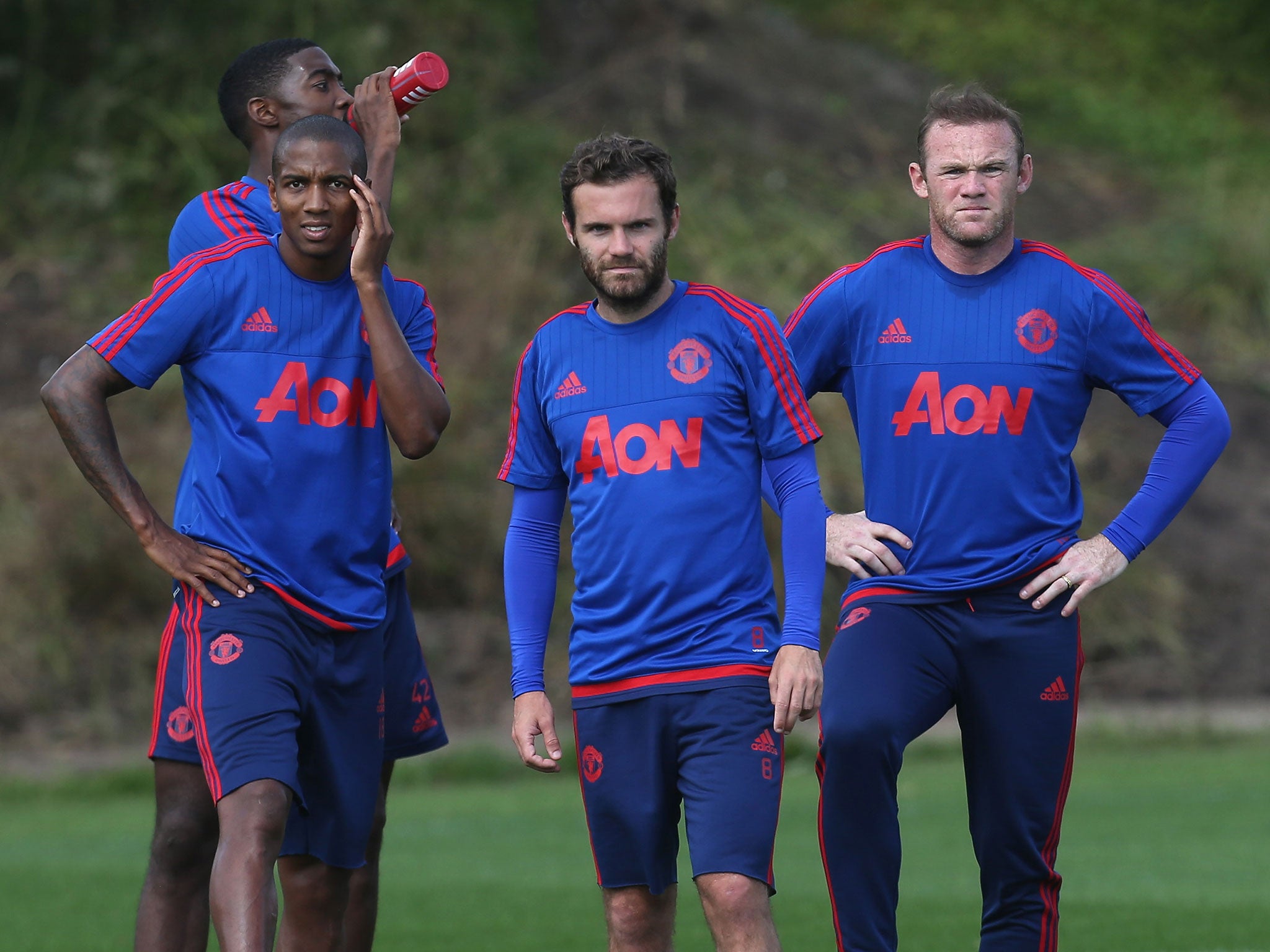 Ashley Young, Wayne Rooney and Juan Mata in training