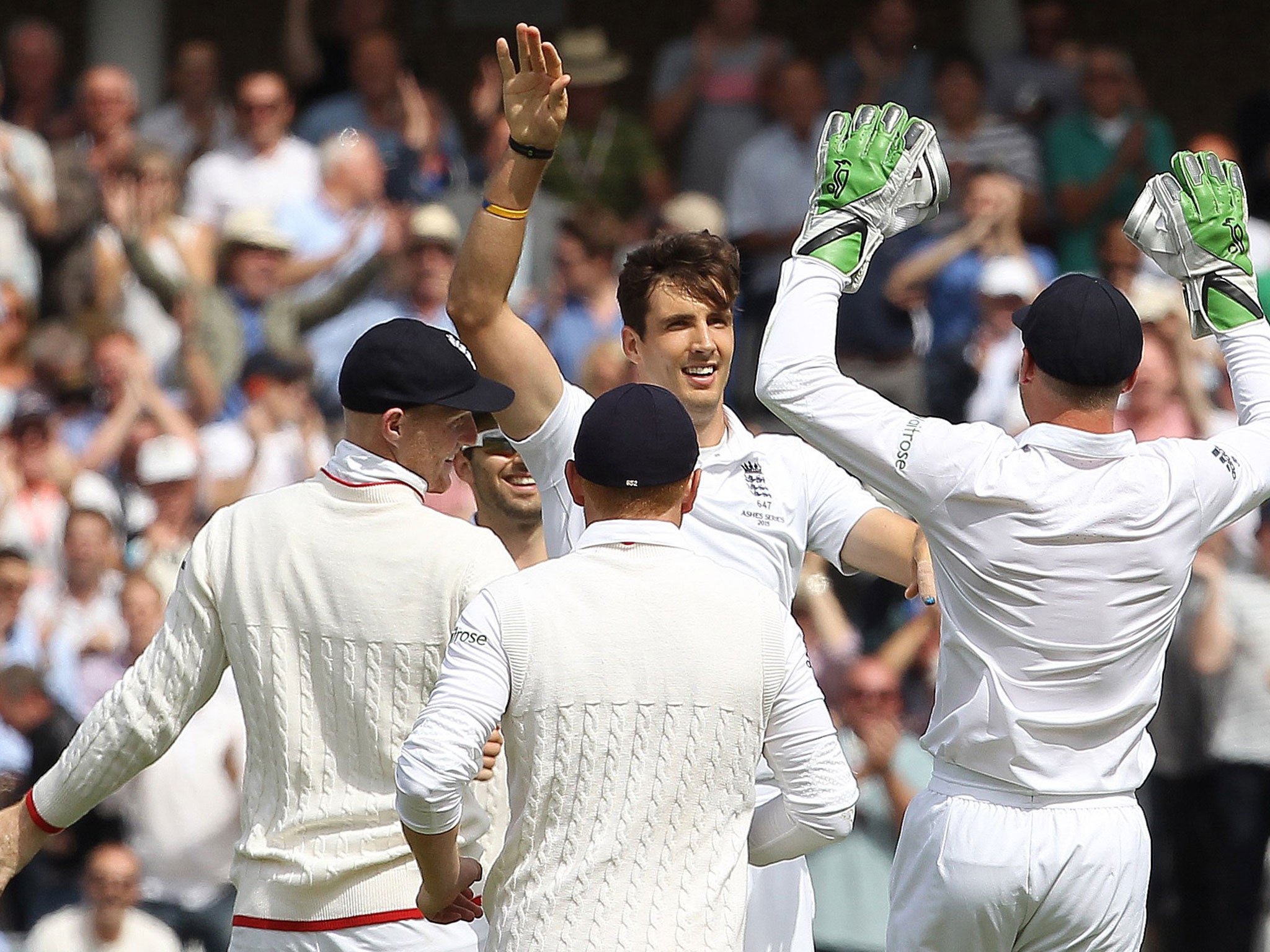 Steven Finn of England celebrates after taking the wicket of Peter Nevill