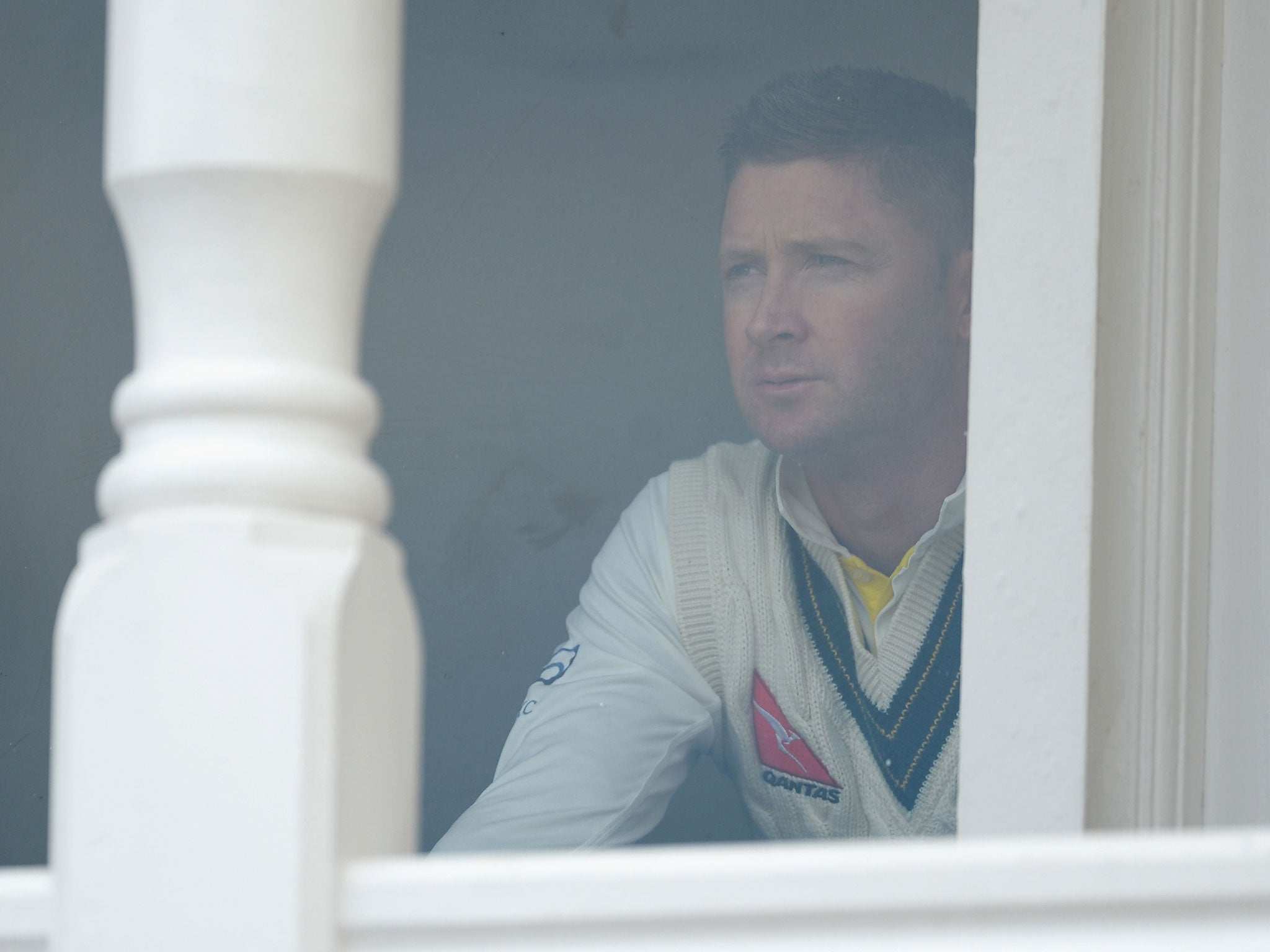 Australian captain Michael Clarke watches his team from the dressing room
