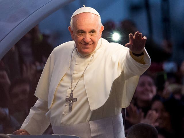 Pope Francis waves from the Popemobile