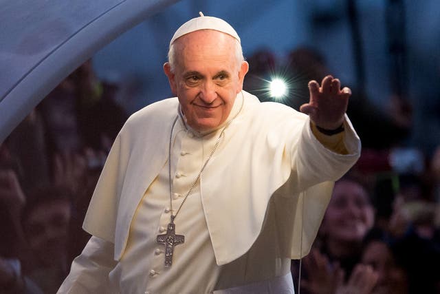Pope Francis waves from the Popemobile