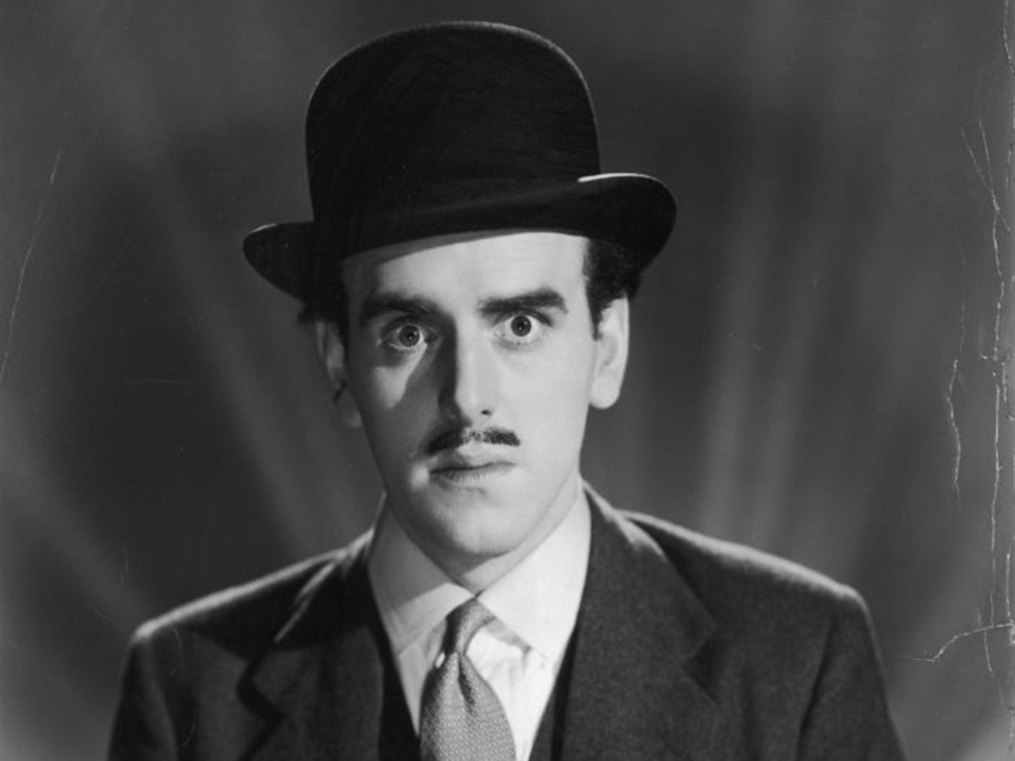 George Cole wearing a bowler hat in 1955