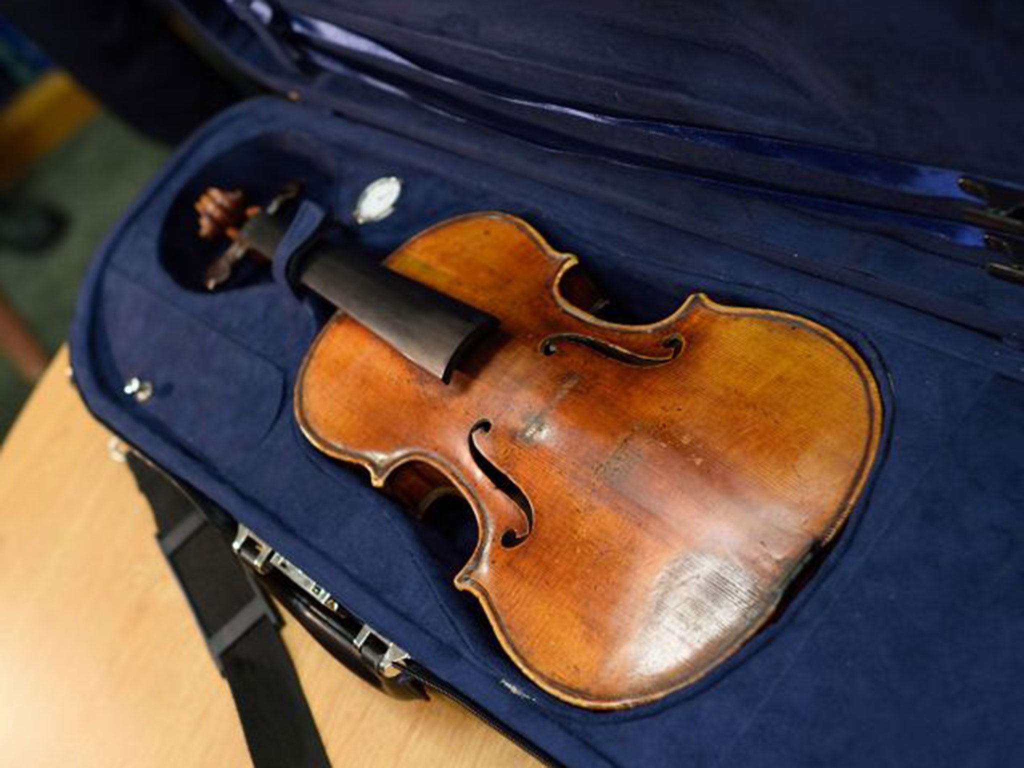 The stolen Stradivarius violin belonging to the late renowned violinist Roman Totenberg is displayed at a news conference August 6, 2015 in New York.