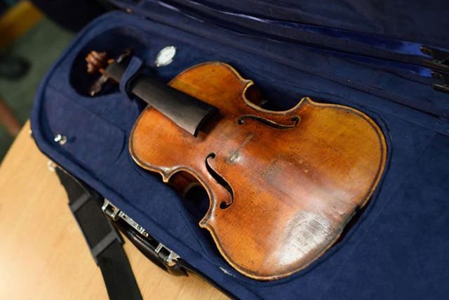The stolen Stradivarius violin belonging to the late renowned violinist Roman Totenberg is displayed at a news conference August 6, 2015  in New York.