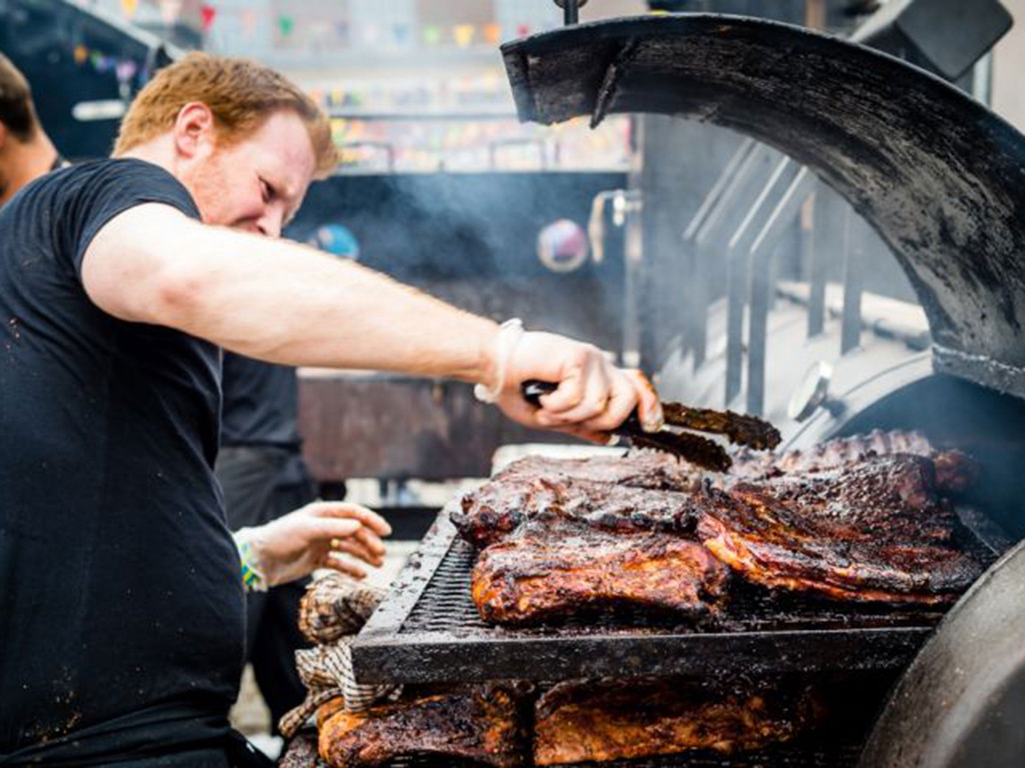 Meat sizzles on the barbecue at the Meatopia festival