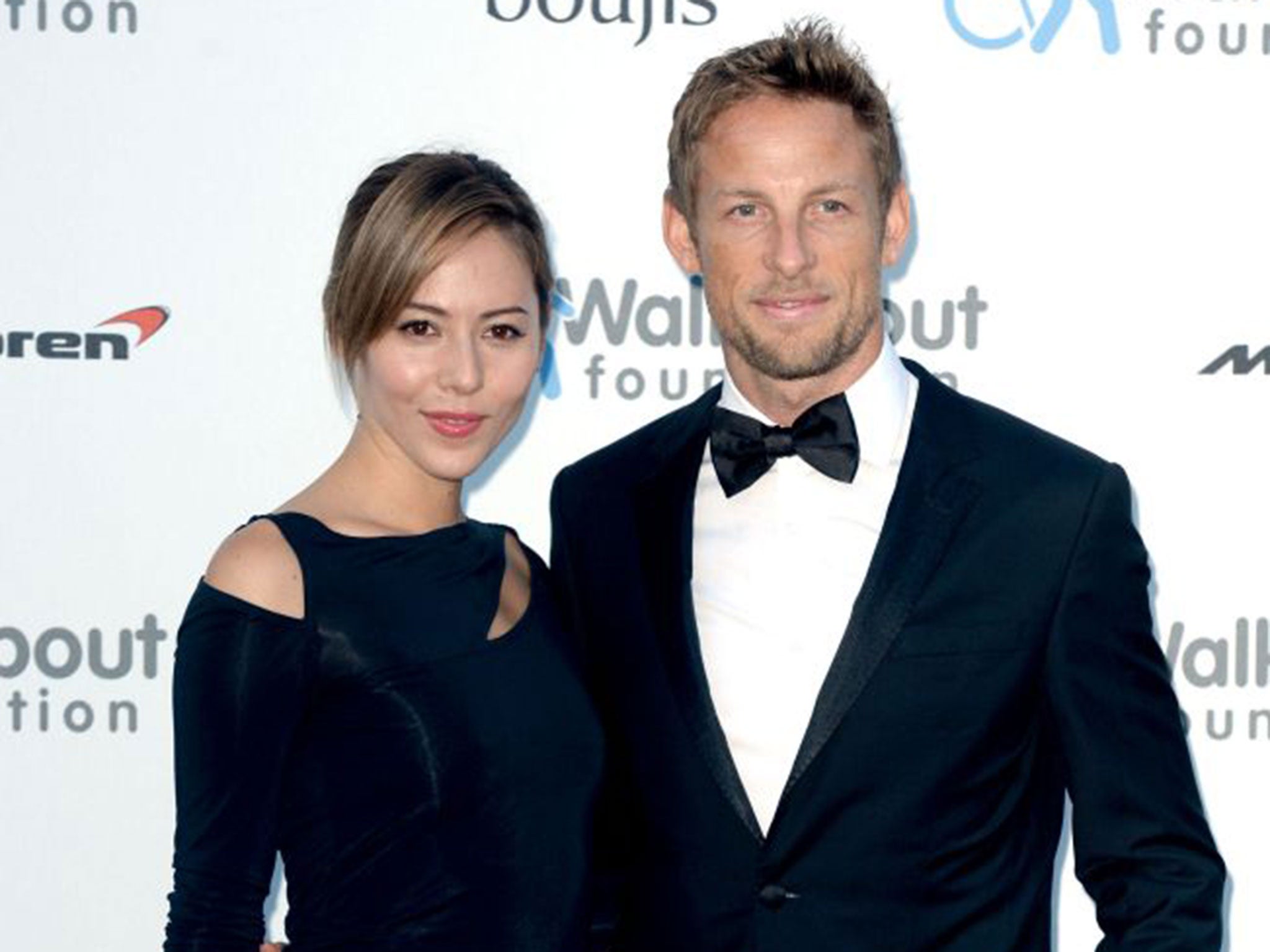 Jenson Button and his wife Jessica who have been burgled on holiday and "most upsettingly" the thieves made off with her engagement ring.