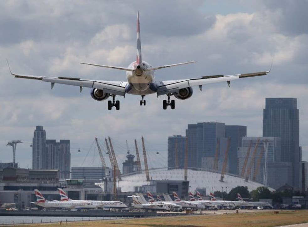 A passenger plane comes into land at London City Airport