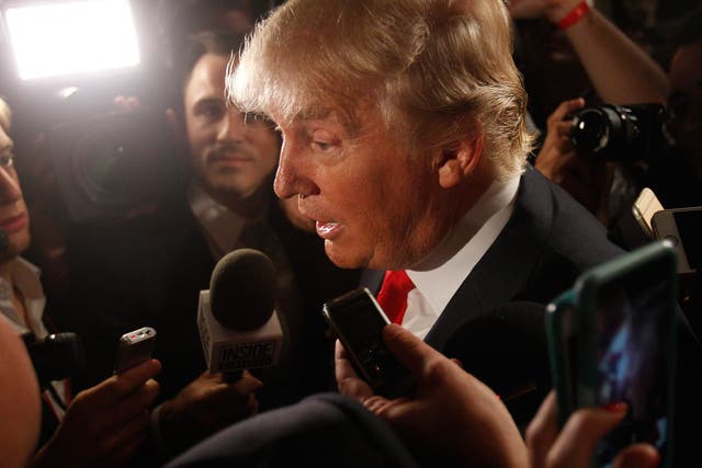 Donald Trump addresses reporters following the debate