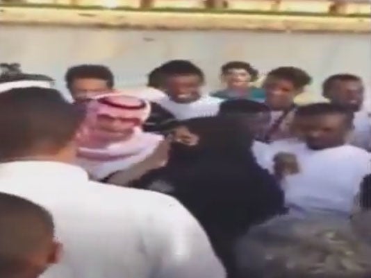 Saudi woman surrounded by group of men in viral video