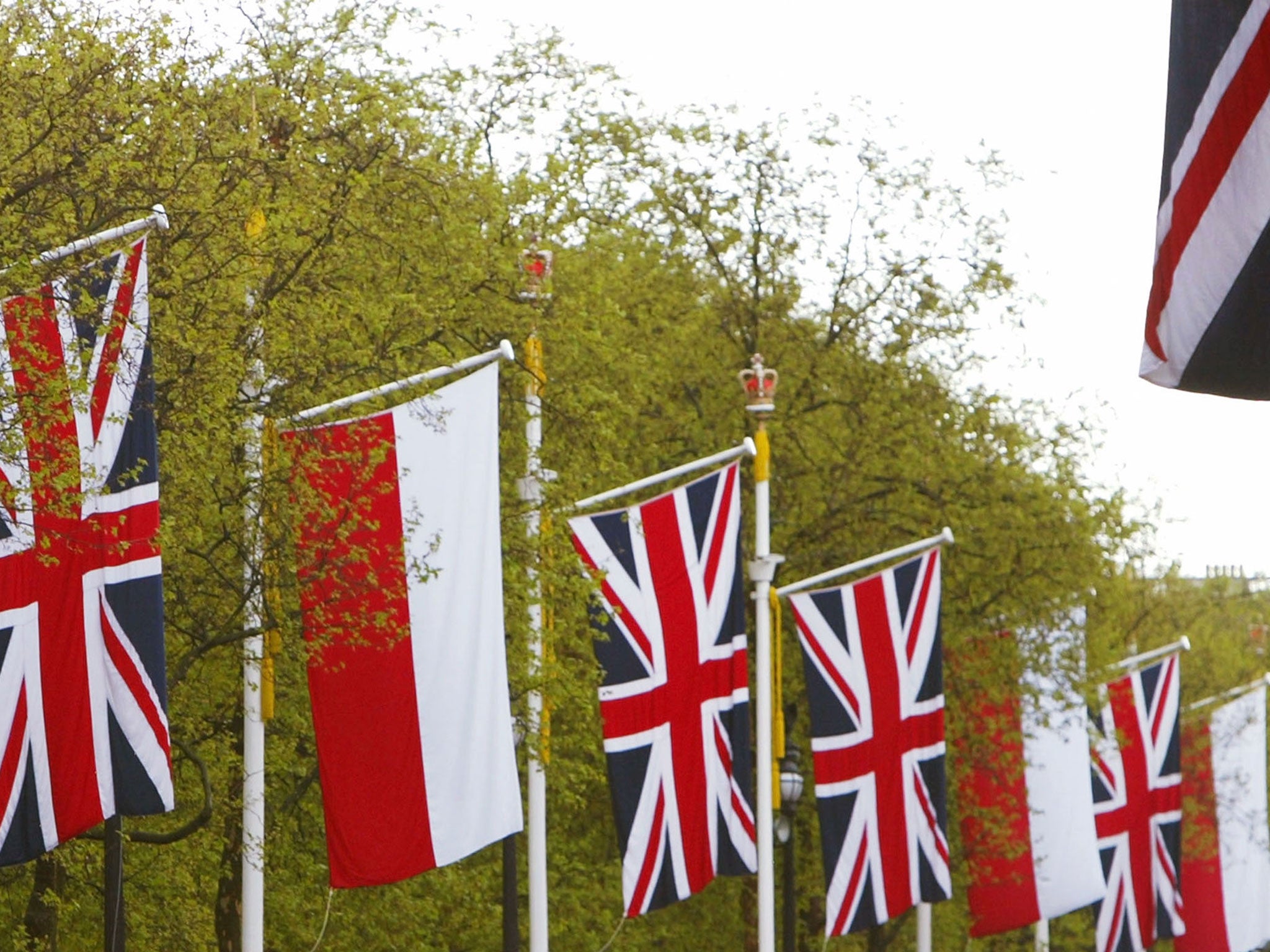 The flags of Poland and Great Britain adorn flag poles along The Mall in London