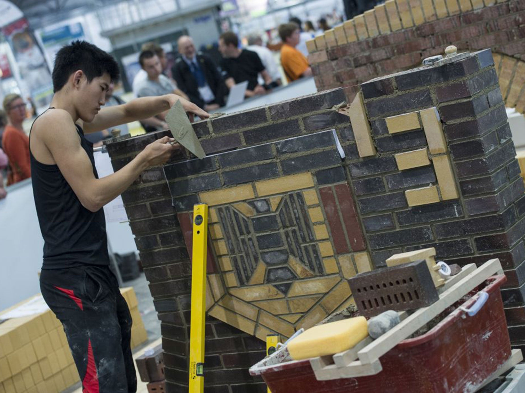 Yeong Wook Kim from Republic of Korea competes in the category bricklaying