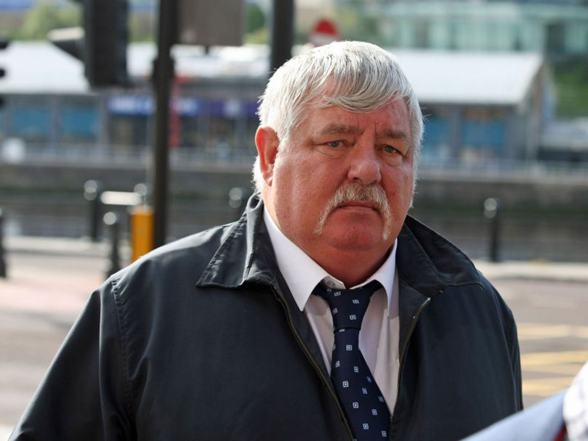 John Yates, a bus driver who failed to stop for 24 metres after hitting and dragging a cyclist under his vehicle, arriving at Newcastle Crown Court 