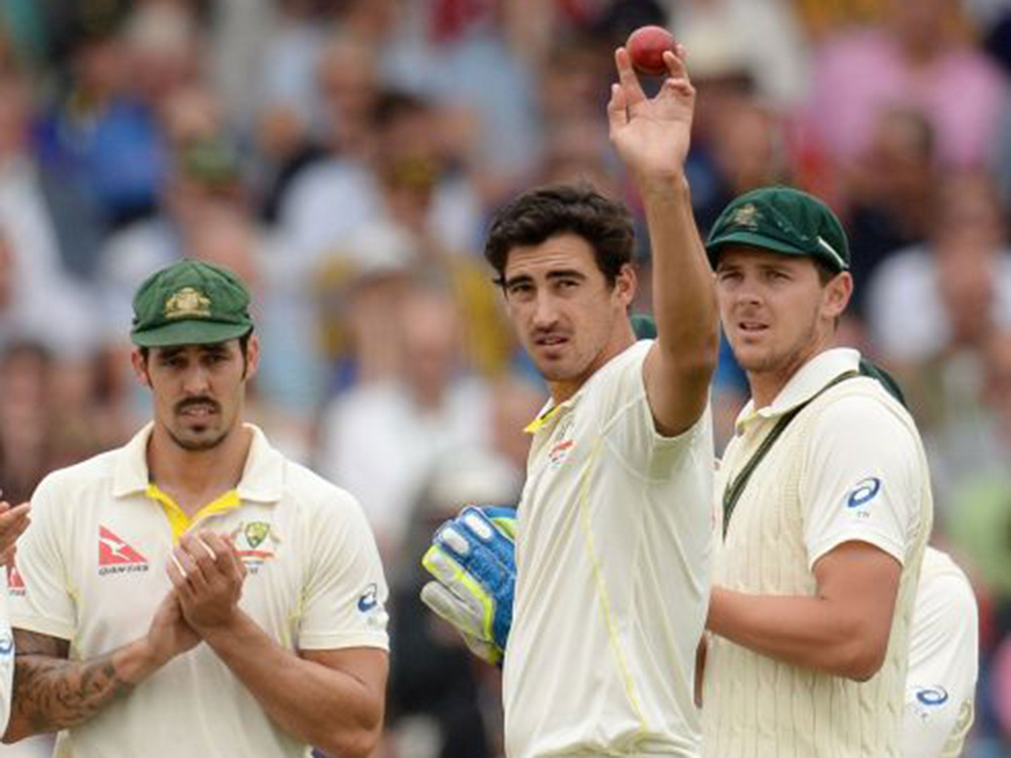 Mitchell Starc celebrates after taking the wicket of Mark Wood to complete his five-fer at Trent Bridge yesterday