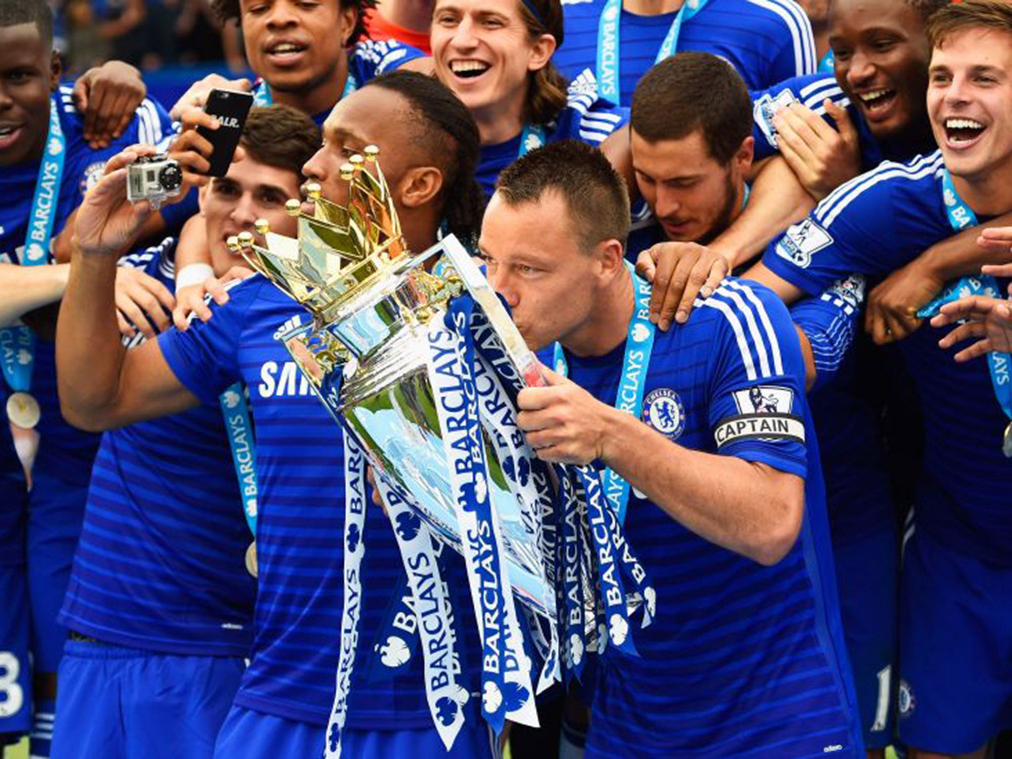 John Terry kisses the Premier League trophy after Chelsea were crowned champions last season