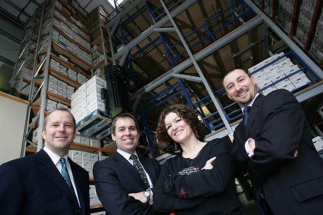 The start of the relationship in 2008: Jason Schofield, left, with staff at Barclays Commercial, which had provided him with finance for his business