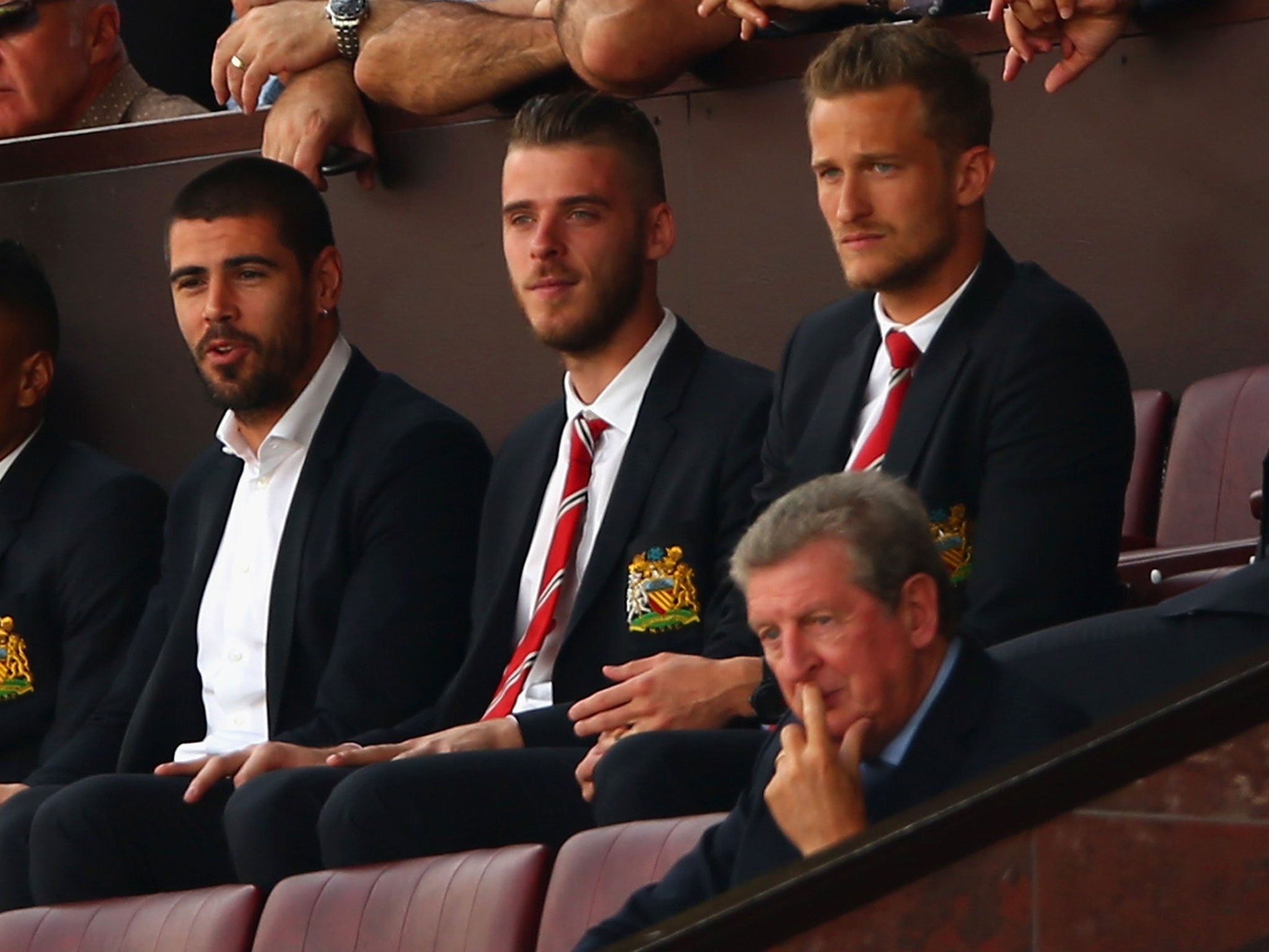 David De Gea, Victor Valdes (centre) and Anders Lindegaard watch Manchester United from the stands