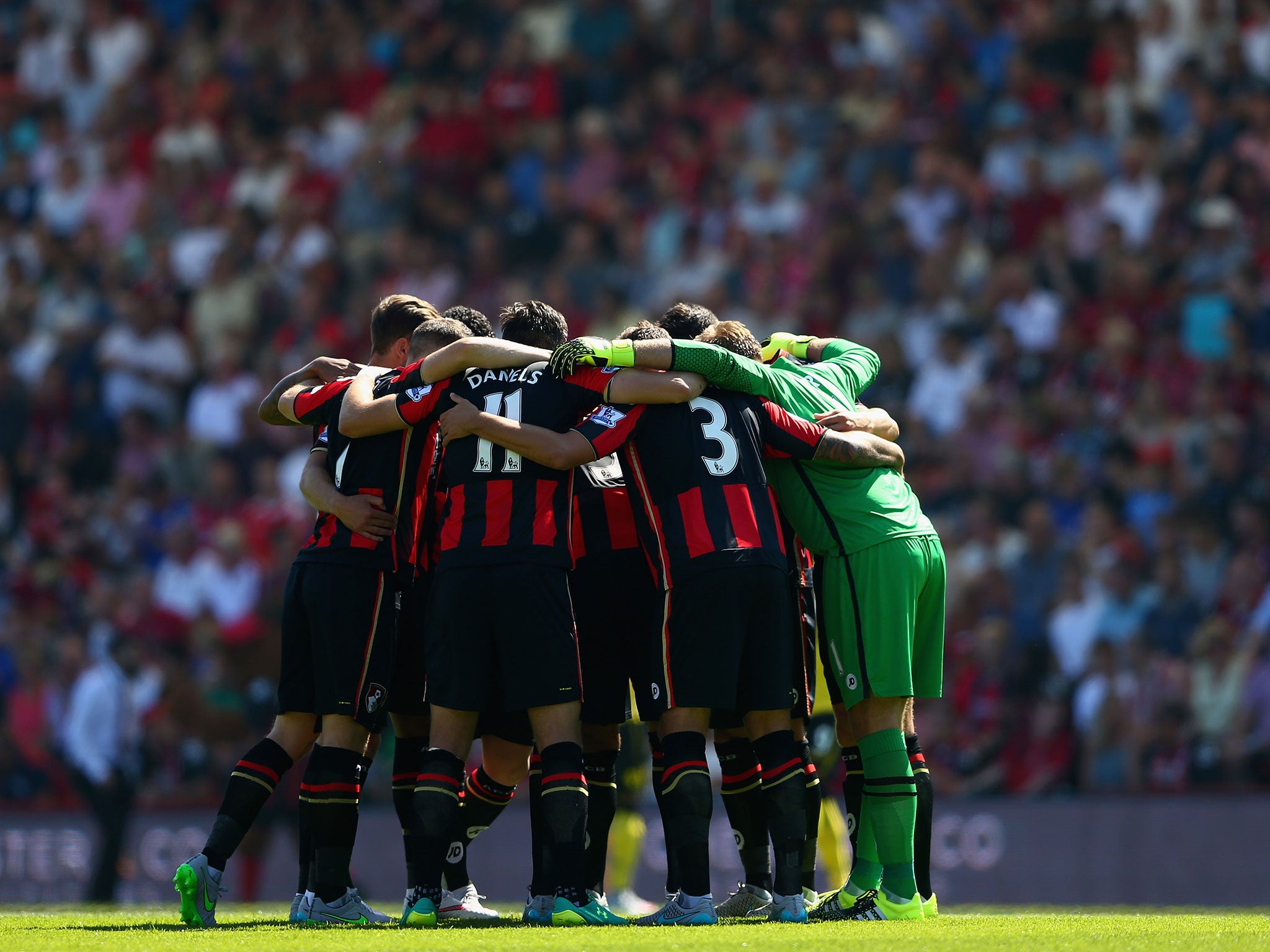 Bournemouth players form a huddle prior to kick off