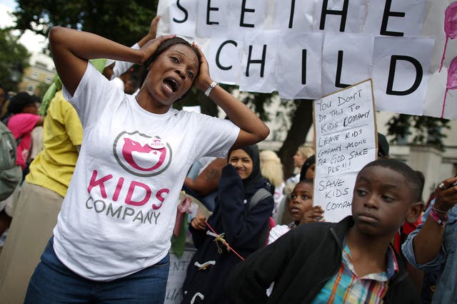 A member of staff  from the Kids Company charity pleads for its survival during a rally near Downing Street on August 7, 2015 