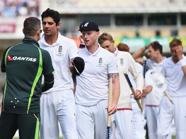 Alastair Cook of England is congratulated by Michael Clarke