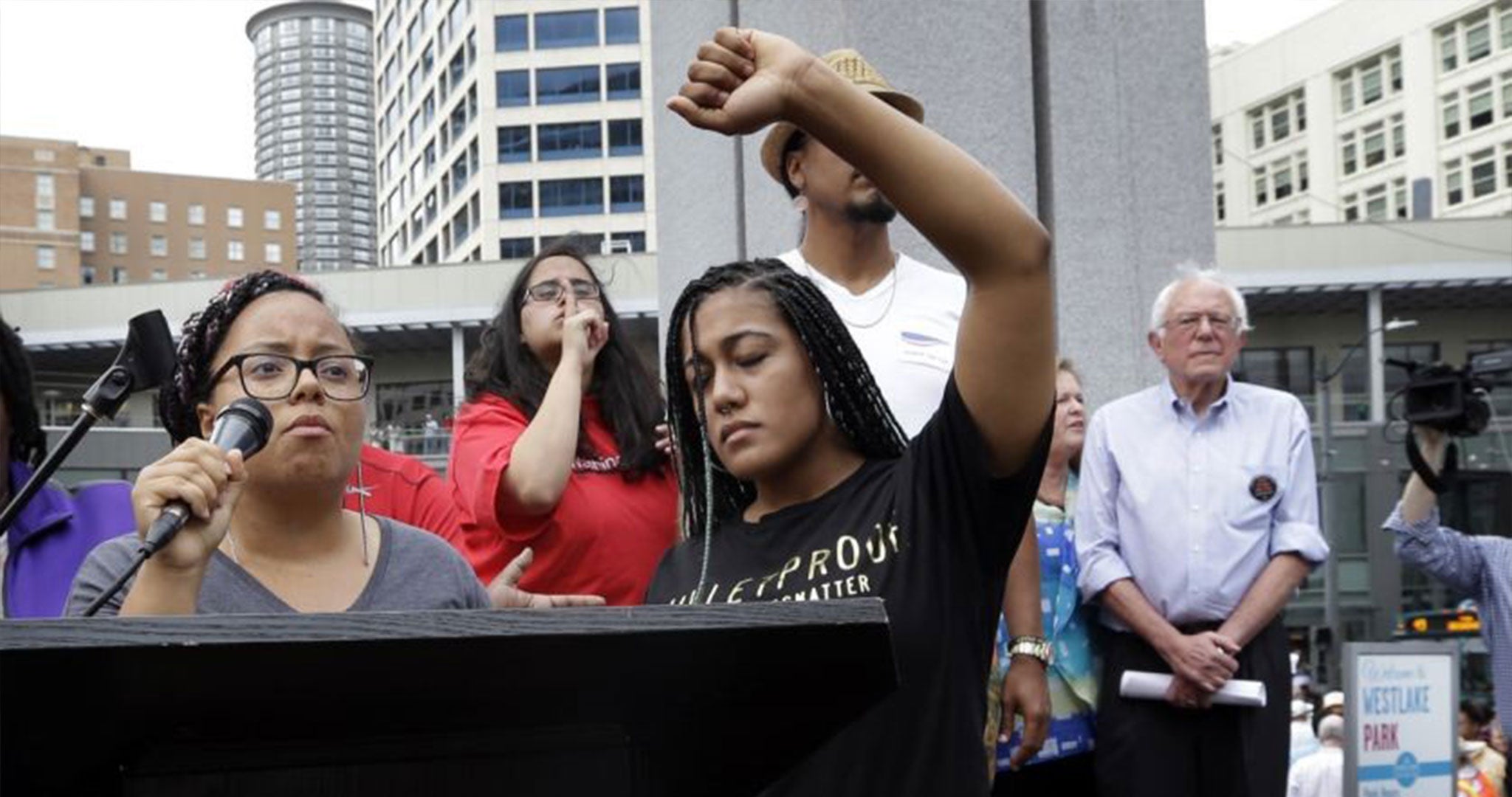 Marissa Johnson, left, and Mara Jacqueline Willaford take over the microphone from Bernie sanders