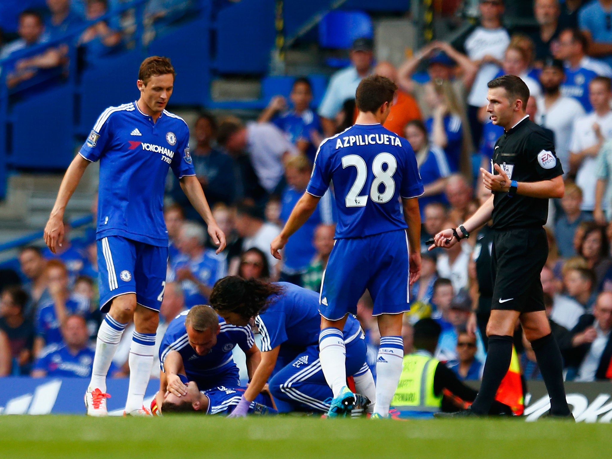 Eden Hazard receives treatment from medics during Chelsea's 2-2 draw with Swansea