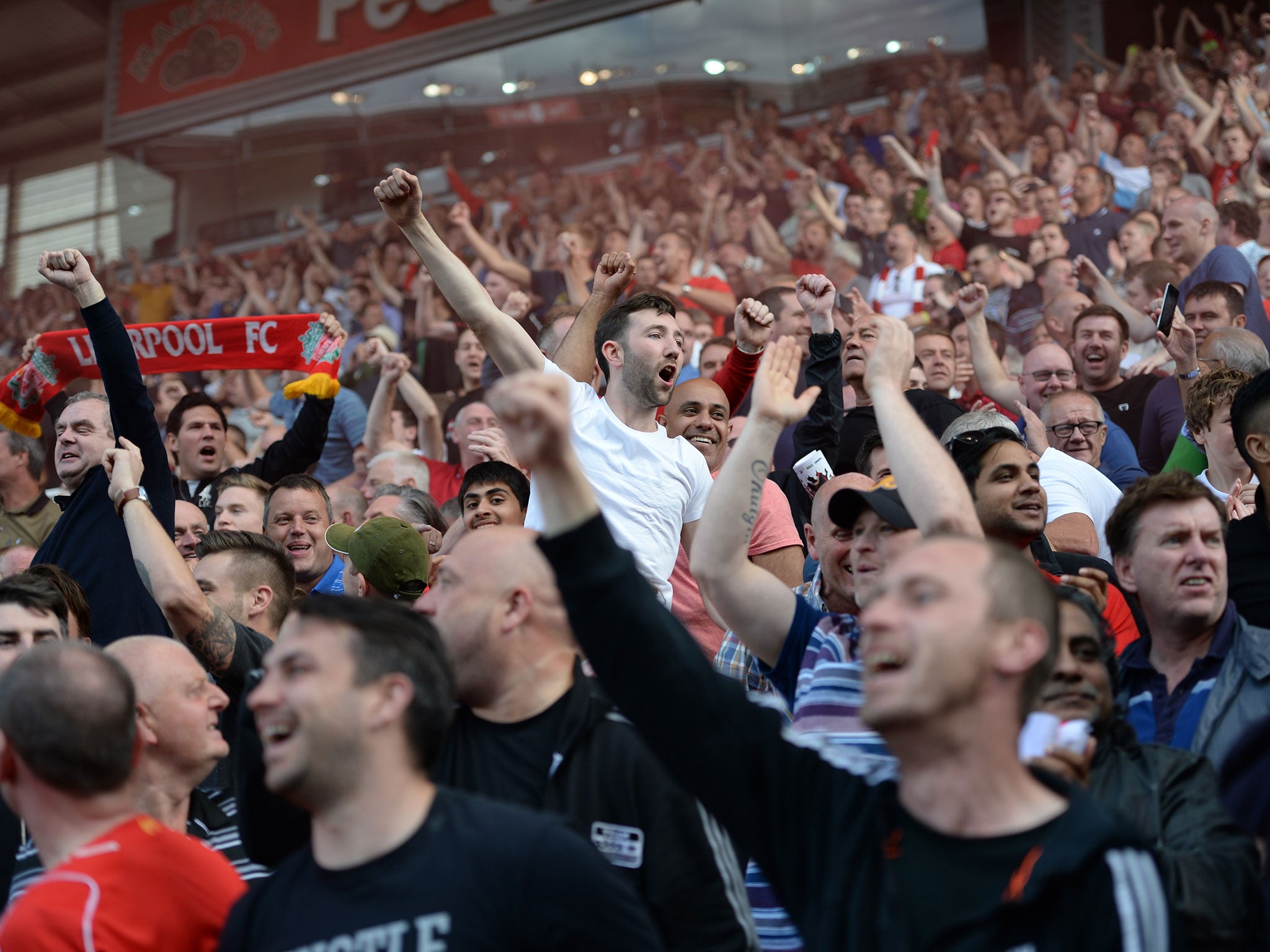 Liverpool fans celebrate during their win at Stoke