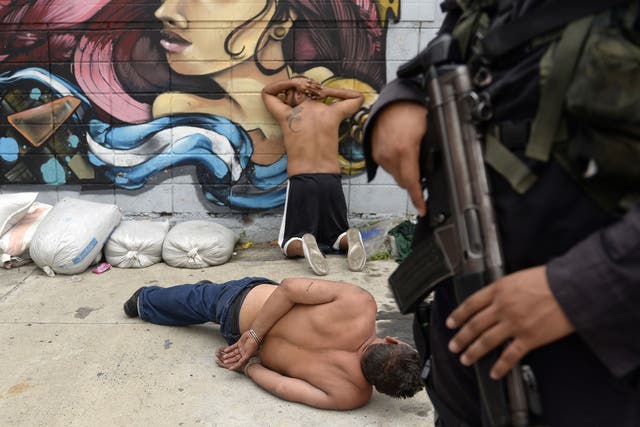 Members of the Barrio 18 gang are rounded up in San Salvador in May. An estimated 10,000 gang members are in the country’s jails