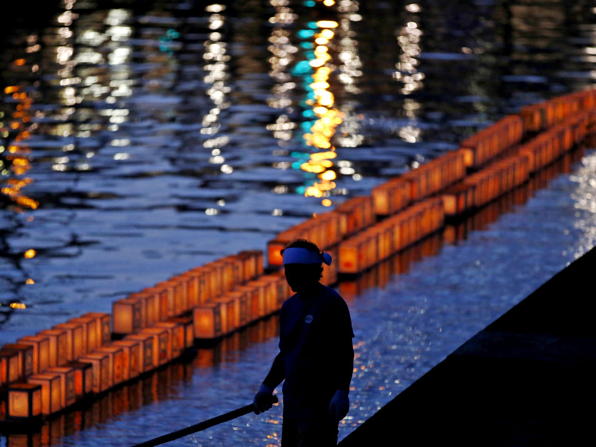 Lanterns adorn the Urakami river in Nagasaki in commemoration of the bomb that would claim 168,000 lives and give rise to a constitution that renounced any role in military conflict