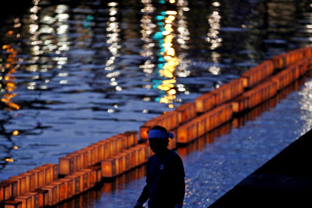 Lanterns adorn the Urakami river in Nagasaki in commemoration of the bomb that would claim 168,000 lives and give rise to a constitution that renounced any role in military conflict
