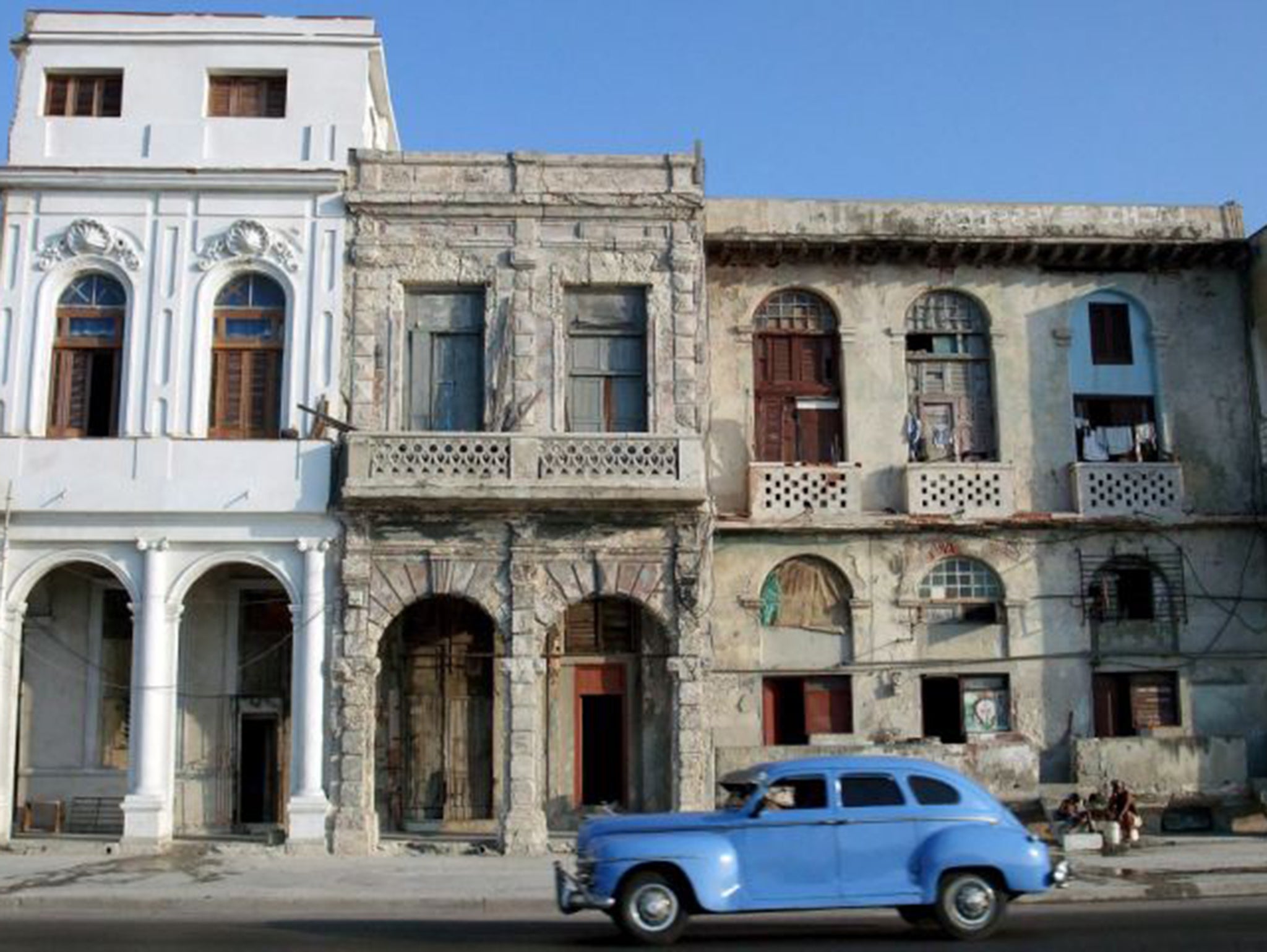 A car runs in the 'Malecon' of Havana, Cuba
