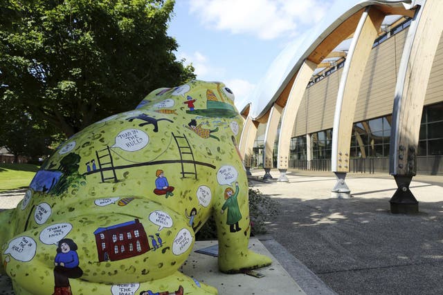 Toad statue by Hull History Centre in Hull, England. The toad is one of the 'Larkin with Toads' project, celebrating the life and work of Philip Larkin (1922 - 1985), the poet, author, jazz critic and librarian.