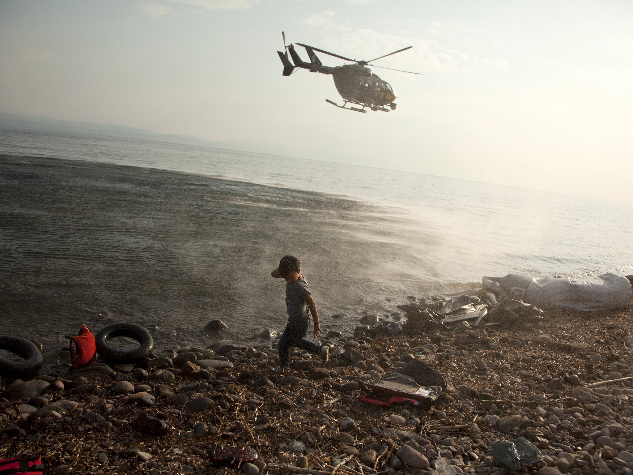 A Frontex helicopter patrols over Lesbos on August 10, 2015
