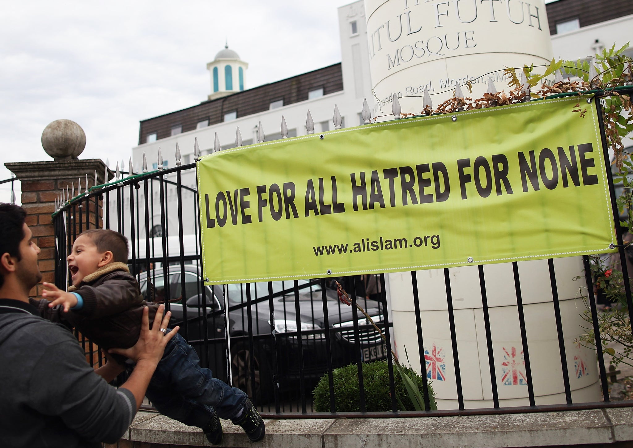 A father and son leave Baitul Futuh Mosque after it was visited by Mirza Masroor Ahmad in 2012