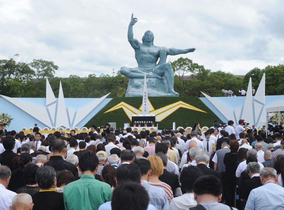 Thousands take place in a silent prayer service at the Nagasaki Peace Park on the bombing's anniversary in 2014