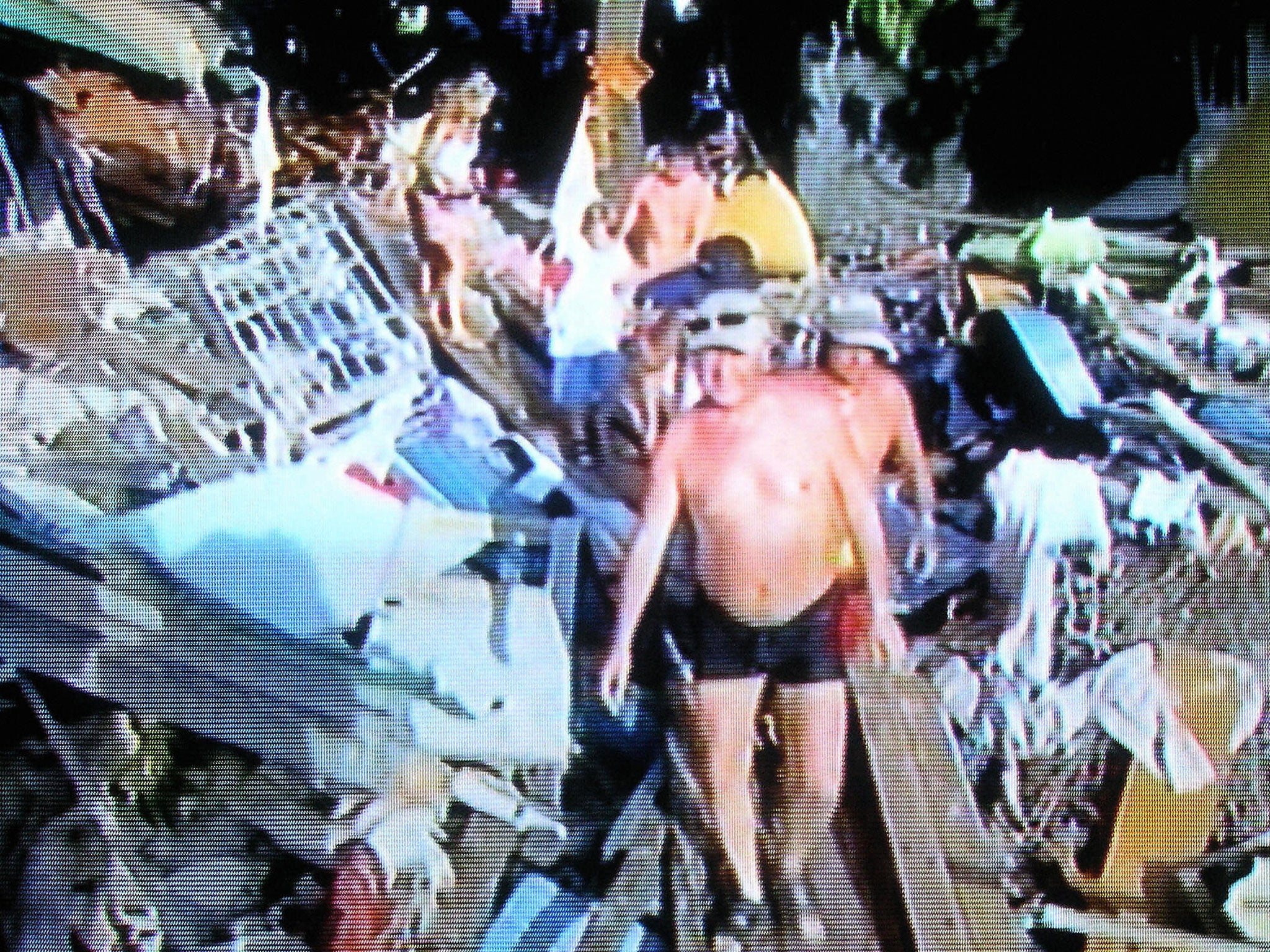 Tourist walk through the debris in Thailand in the aftermath of the 2004 tsunami