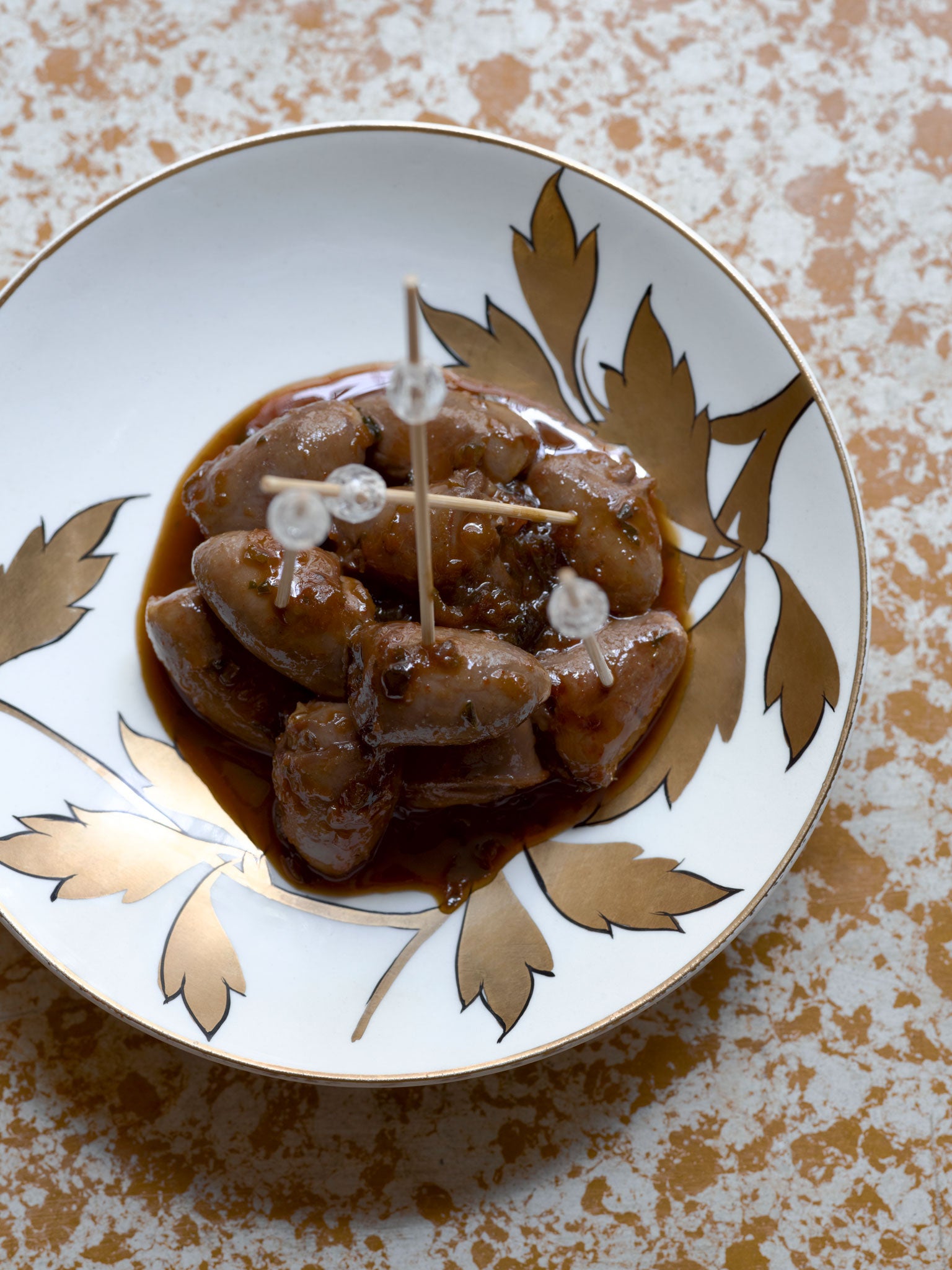 Arrange devilled chicken hearts on a serving dish with a few cocktail sticks, for ease of eating and sharing