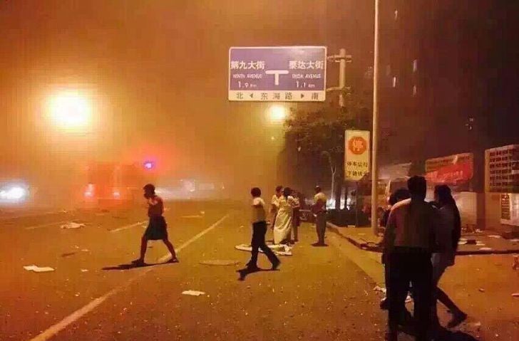 This mobile phone picture shows people on the street in the aftermath of the explosion