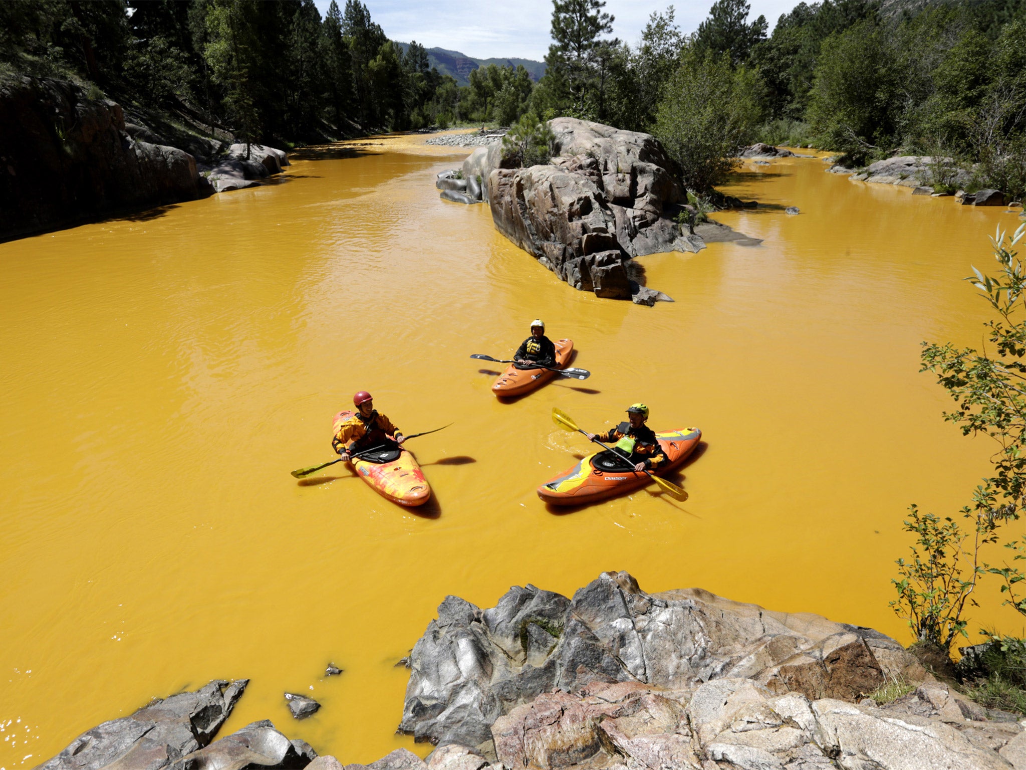 Kayakers paddle on the Animas river in Colorado after three million gallons of effluent escaped in last week’s accident