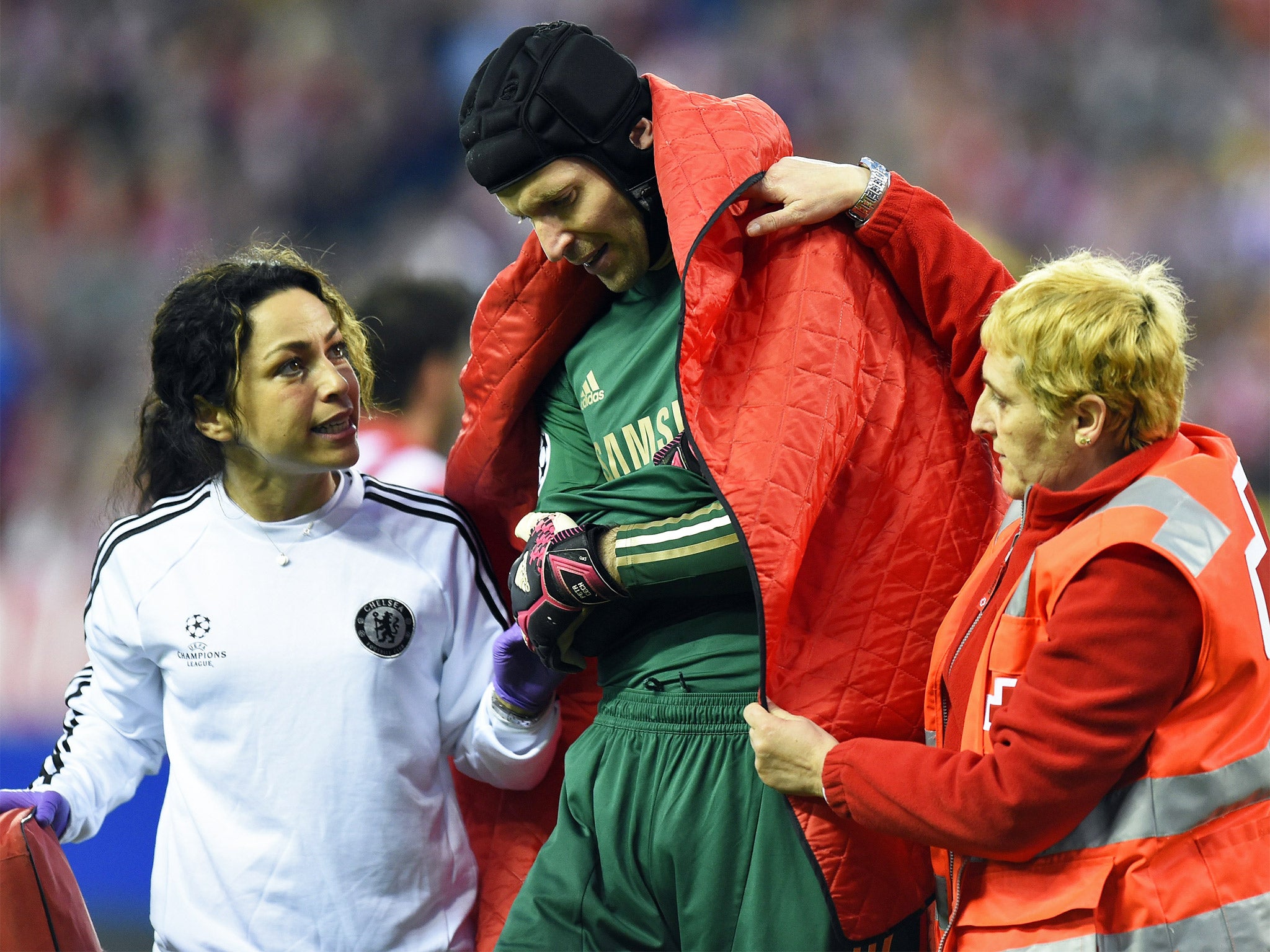 Chelsea’s goalkeeper Petr Cech is helped from the pitch by team doctor Eva Carneiro (left) last year after he was injured against Atletico Madrid