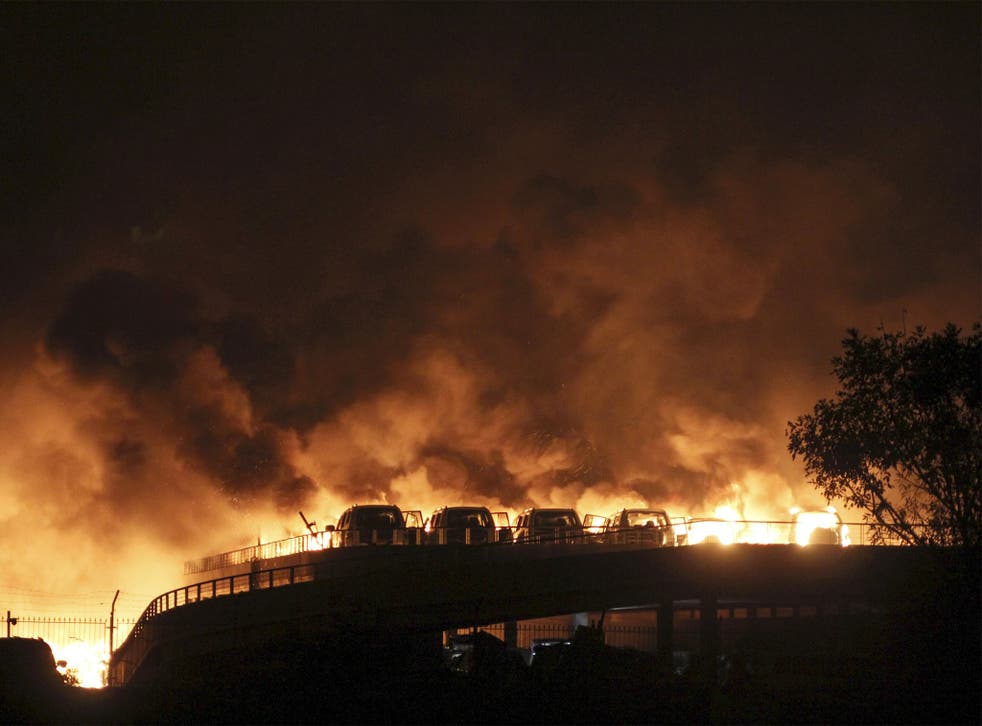 Cars burning during the blaze in Tianjin