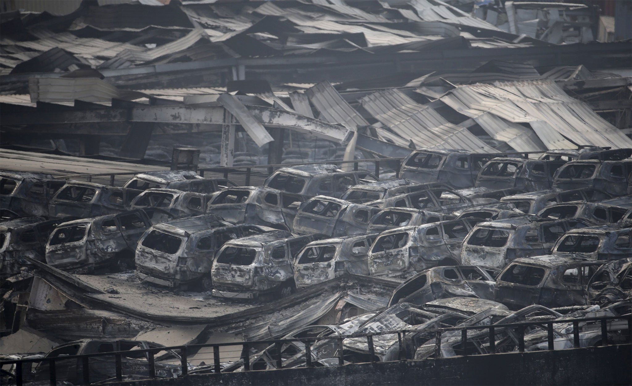 Burned-out cars lined the streets of Tianjin