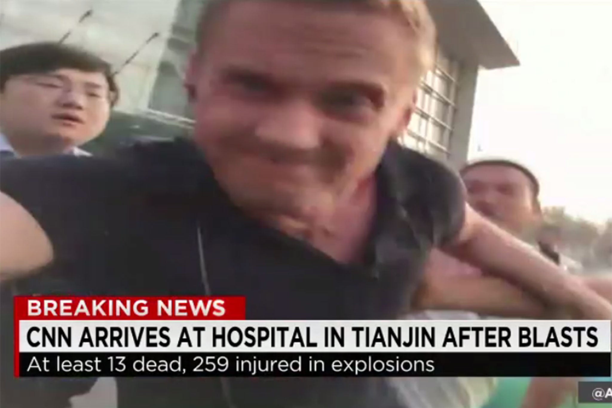 CNN's Will Ripley was accosted by angry locals outside a hospital where he was filming in Tianjin