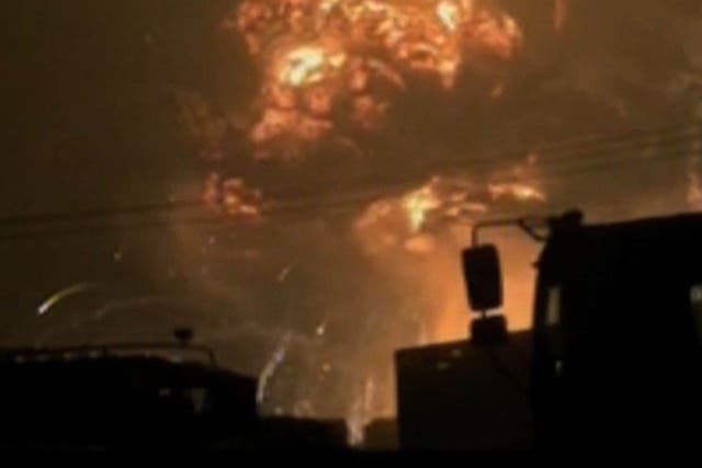 A screen grab from taken from state broadcaster China Central Television (CCTV) footage on August 12, 2015 shows a huge explosion in the northern Chinese port city of Tianjin.